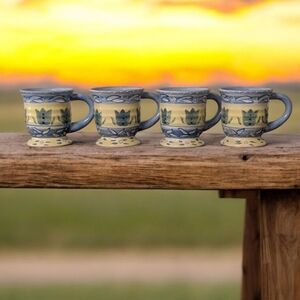 Set Of 4 Nanette Vacher Mugs.